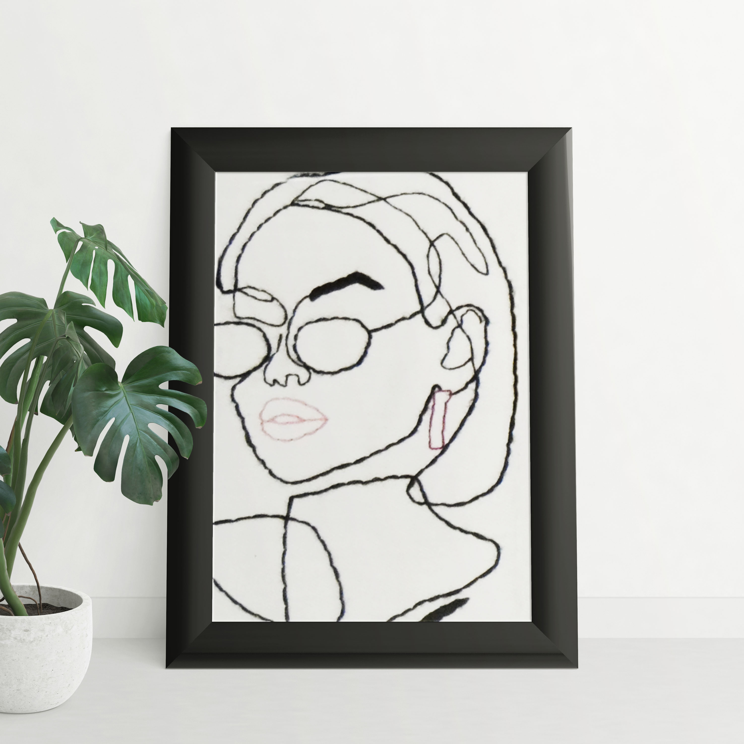 Portrait brodé portant des lunettes